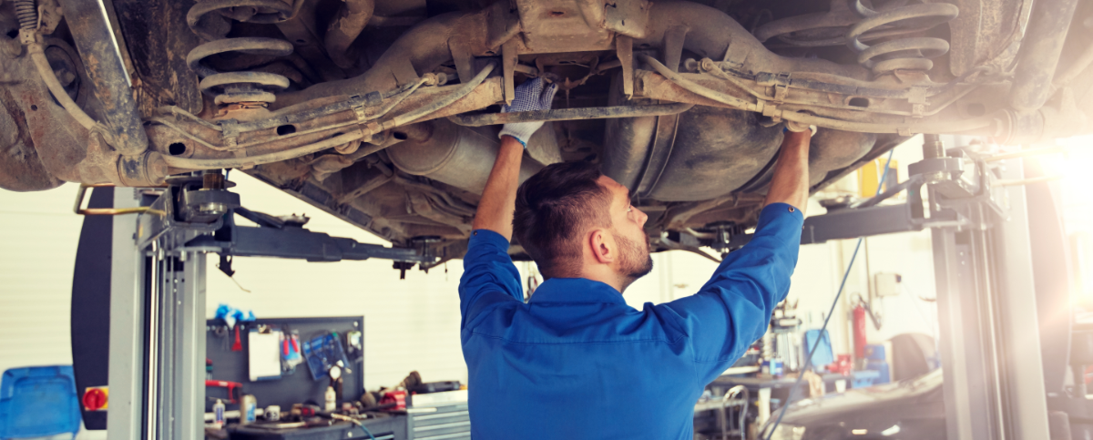 Mechanic pouring in engine oil - Car Servicing Westcliff